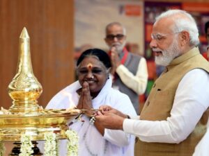 Prime Minister Narendra Modi lighting the lamp at the inauguration of the state-of-the-art Amrita Hospital